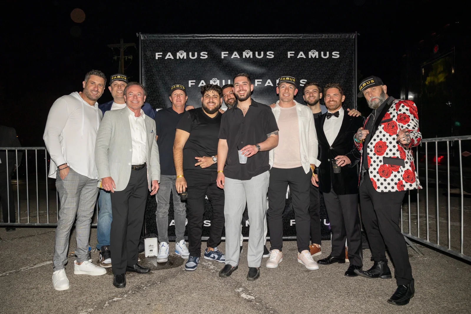 Group gathered in front of a FAMUS backdrop at an event
