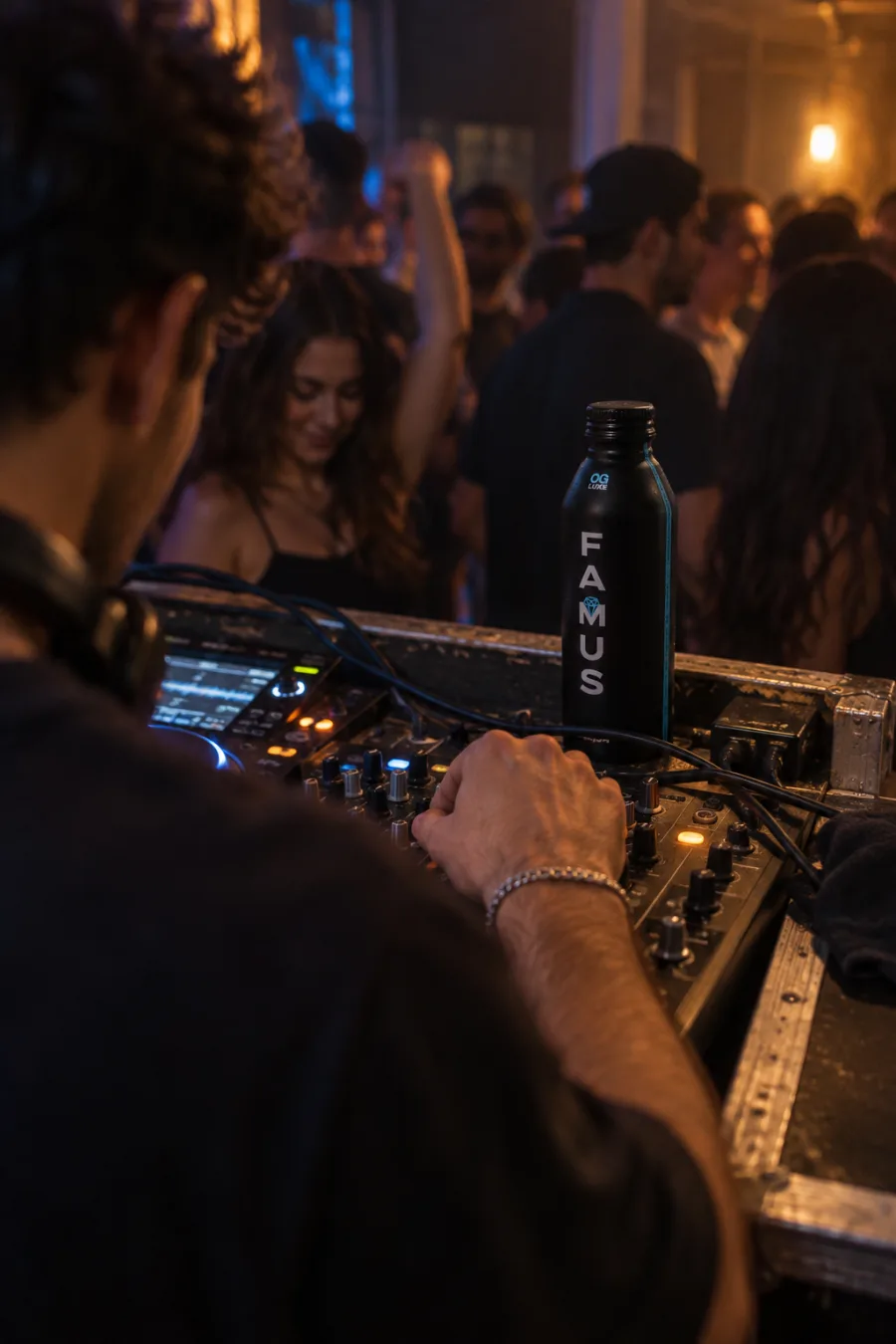 Illustrative scene of OG Luxe beside a DJ mixer